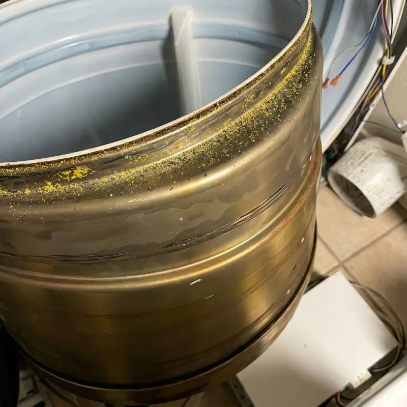 Worn flat LG dryer drum rollers removed — set of four