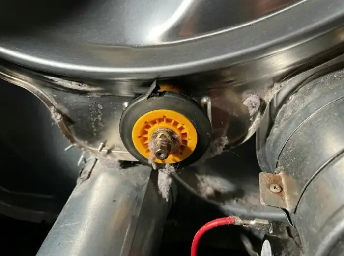 Worn LG dryer drum rollers — flat surfaces causing thumping and drag